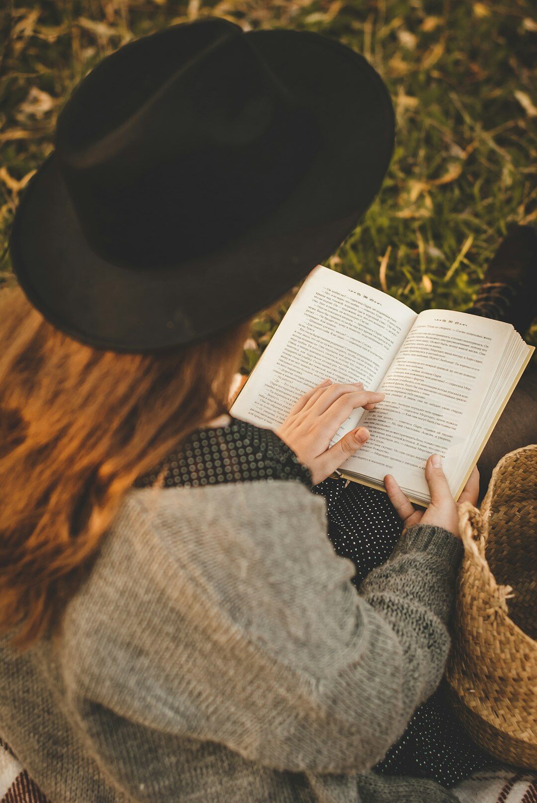 person reading mystery book